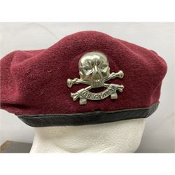 Assorted militaria including ten leather or canvas cartridge and other belts, maroon beret with 17th Lancers cap badge, modern bullet mould, leather and brass shot flask, two knives, shell cases, boomerang etc; in tin deed box