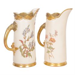 Royal Worcester blush ivory quatrelobe coral jug, decorated with floral sprigs shape 1507 together with two jugs with a shell moulded rim and decorated with flowers, shape 1229, all with puce marks beneath, quatrelobe jug H22cm 
