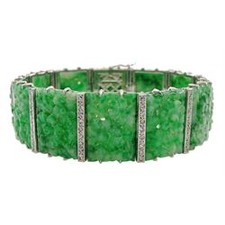 Art Deco platinum and white gold jadeite and diamond bracelet, twelve carved foliate jadeite panels, separated by a row of milgrain set old cut diamonds