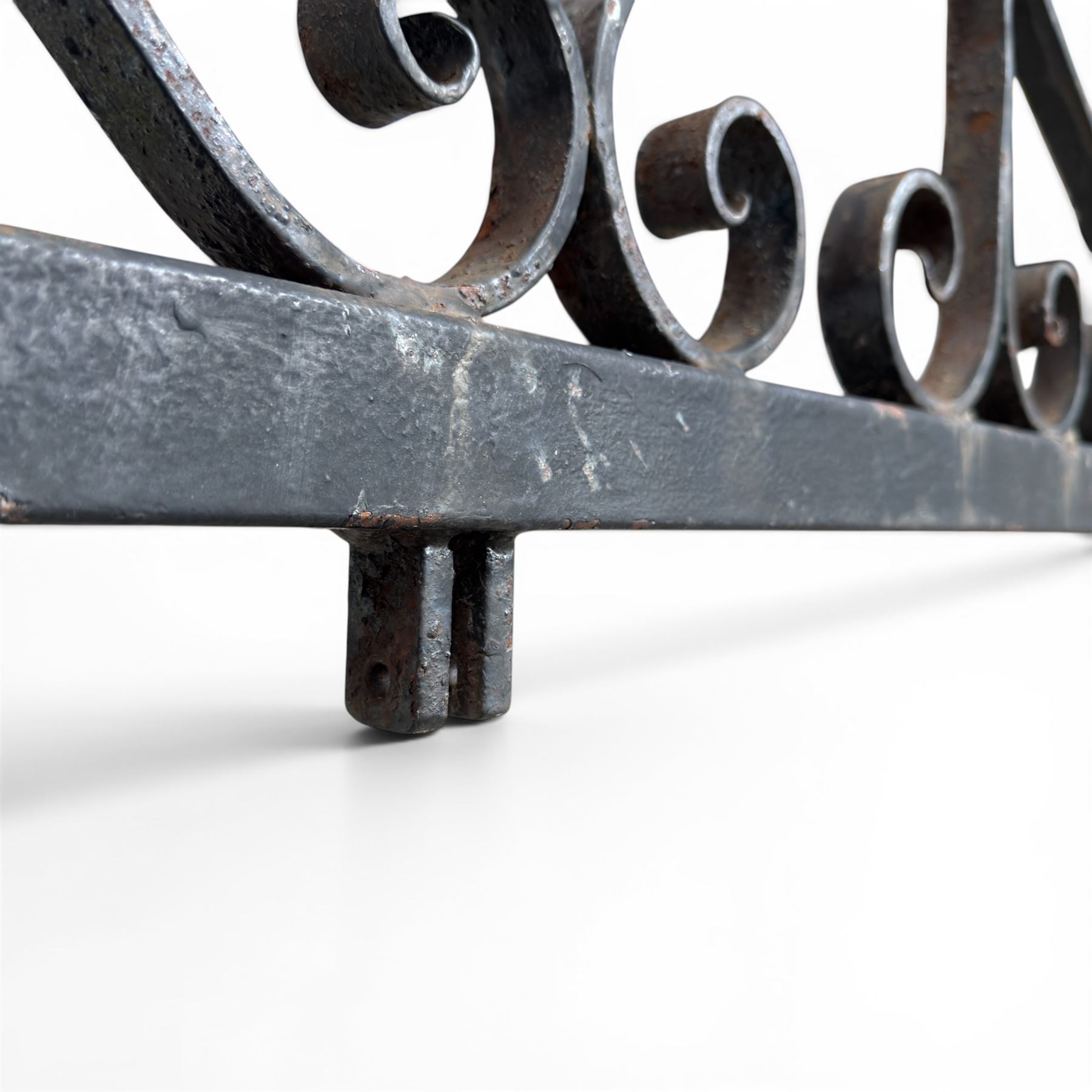 Antique wrought iron sign bracket, with strapwork scroll decoration and arrow form support, in weathered black painted finish
