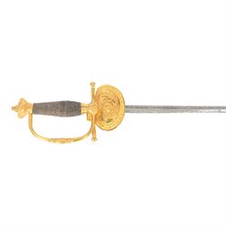 British Victorian court sword, for members of the Royal Household, by W.K & C of Solingen and retailed by Besch of Hanover St London, the 80cm blade etched to both side, the single bar hilt of gilt brass with Queens' crown pommel and downturned shell guard with the monogram of Queen Victoria, the wooden grip covered with silver wire, within leather scabbard with three gilt brass mounts and twin suspension rings, overall L96cm   