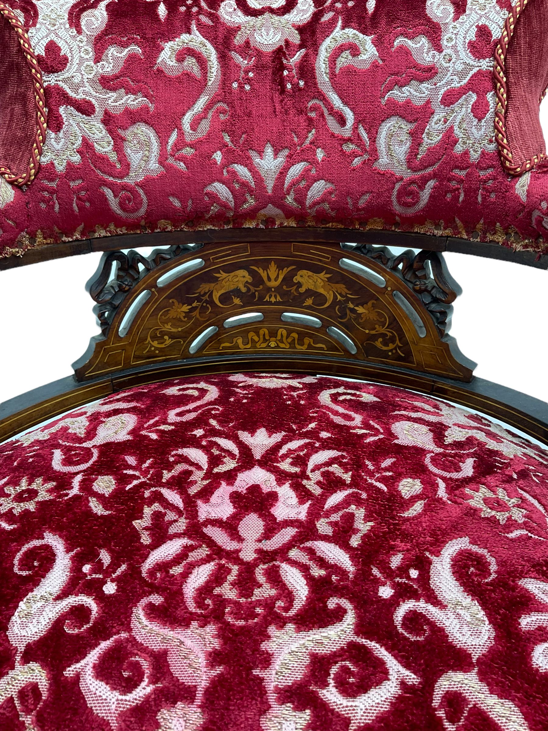 Edwardian inlaid rosewood salon suite, upholstered in red and gold fabric, comprising two seat sofa, pair of tub shaped armchairs, and four side chairs