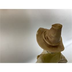 A Belcari figural table lamp, modelled as a young gent leaning upon brick wall, on turned wood base, signed, H70cm incl shade, together with bronzed figural table lamp of a lady with parasol upon ornate circular plinth base, two ceramic table lamps and another lamp (5)