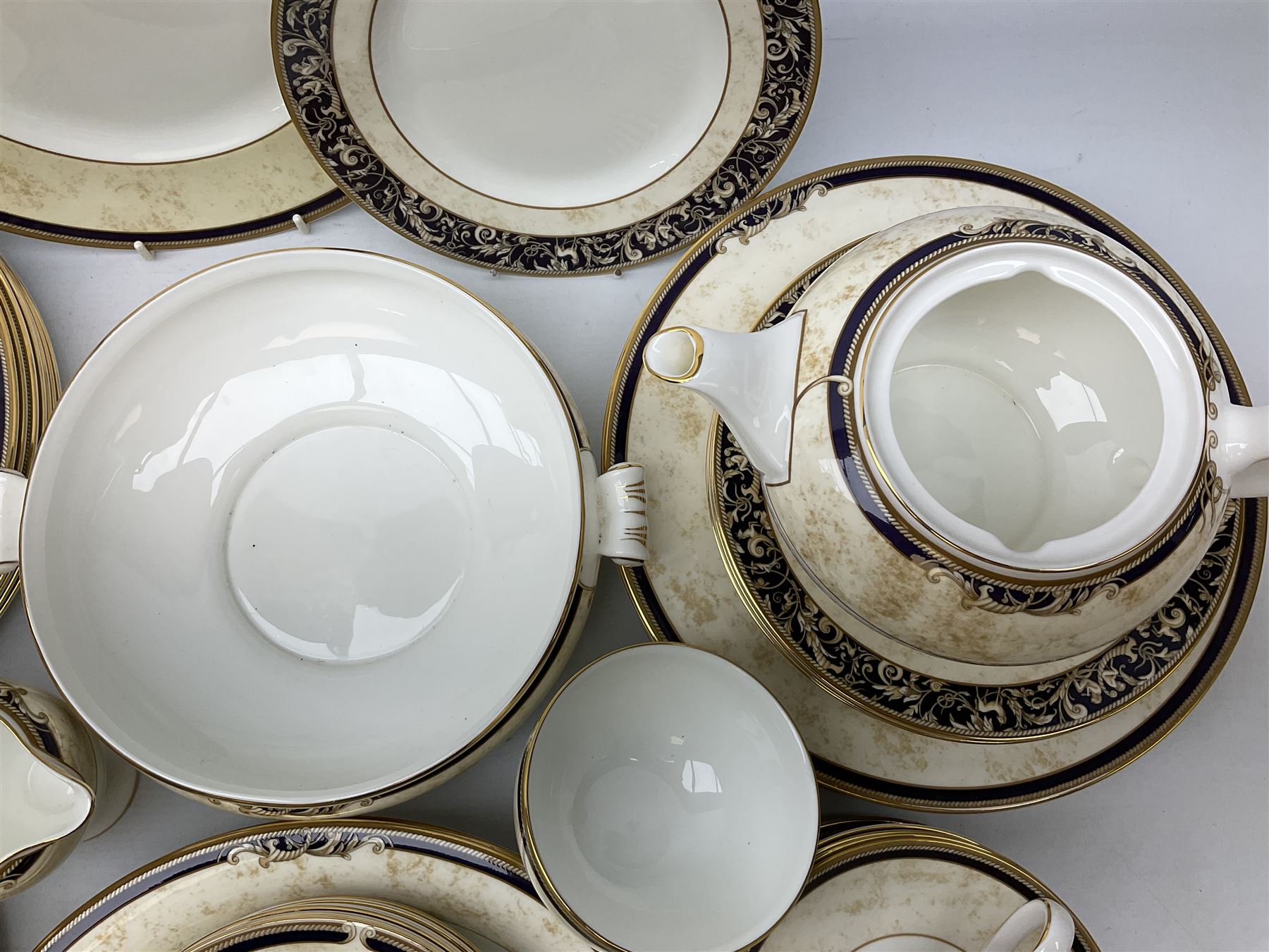 Wedgwood cornucopia pattern tea and dinner service, comprising teapot, ten cups and saucers, milk jug, open sucrier, eight dessert plates, fourteen dinner plates, eight side plates, six bowls, two open serving dishes and one covered twin handled dish (53)