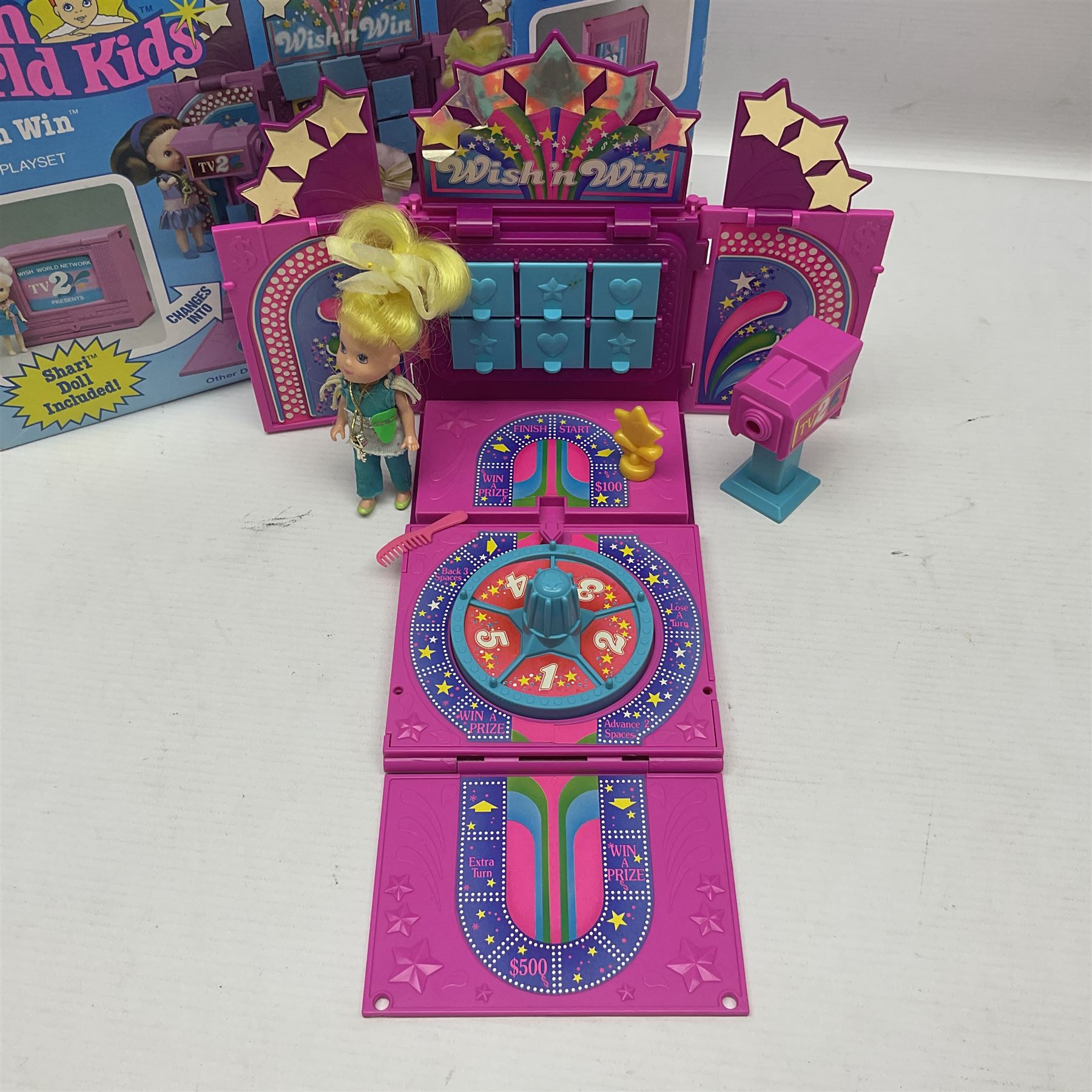 Wish World Kids - Eleven play sets comprising Treats ‘n Sweets Refrigerator, Grin ‘n Win TV, Sponge ‘n Plunge Bathtub, Socks ‘n Locks Dresser, Spice ‘n Slice Stove, Sleep ‘n Leap Bed, File ‘n Smile Desk, Blaze ‘n Braise Fireplace, Hear ‘n Cheer playset in Sponge ‘n Plunge box, two Read ‘n Speed Chair playsets in one box