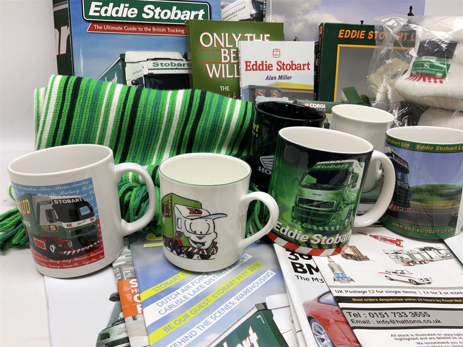 Eddie Stobart - accessories, memorabilia and promotional merchandise including Corgi Self Assembly Model Transport Depot and Five Figures Set; scarf; slippers; mugs and beakers; coasters; note book; books etc