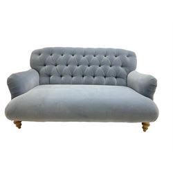 Tetrad - two seat sofa upholstered in baby blue buttoned fabric, on turned light beech front feet 