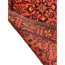 Persian red ground runner, decorated with four Herati motif medallions, the border decorated with repeating plant motif design