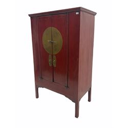  Chinese red lacquered elm and pine Moon marrige cabinet, enclosed by two doors, brass metalwork and hinges