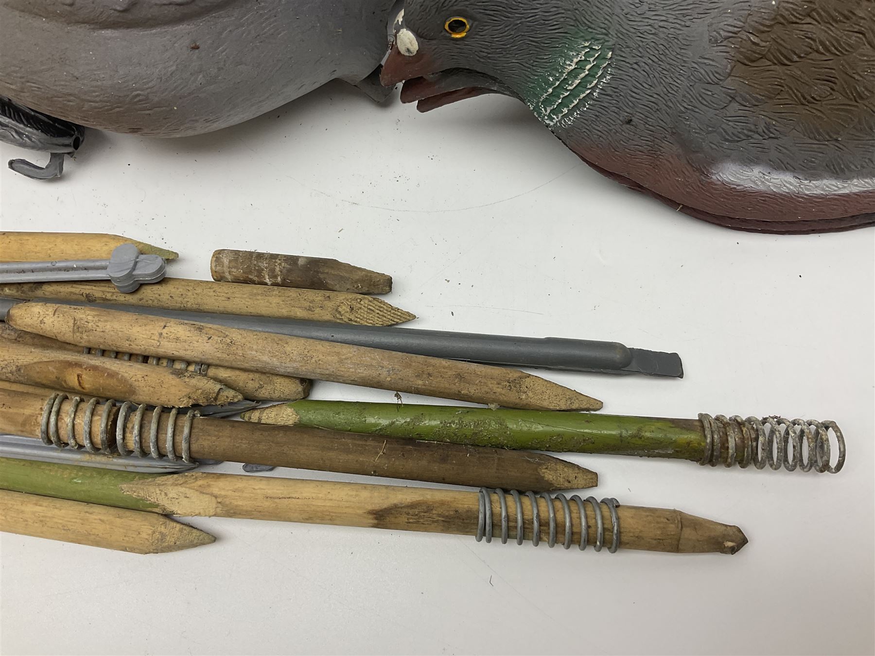 Eighteen plastic pigeon decoys comprising ten full body and eight shells with quantity of various stakes; some marked made in Italy