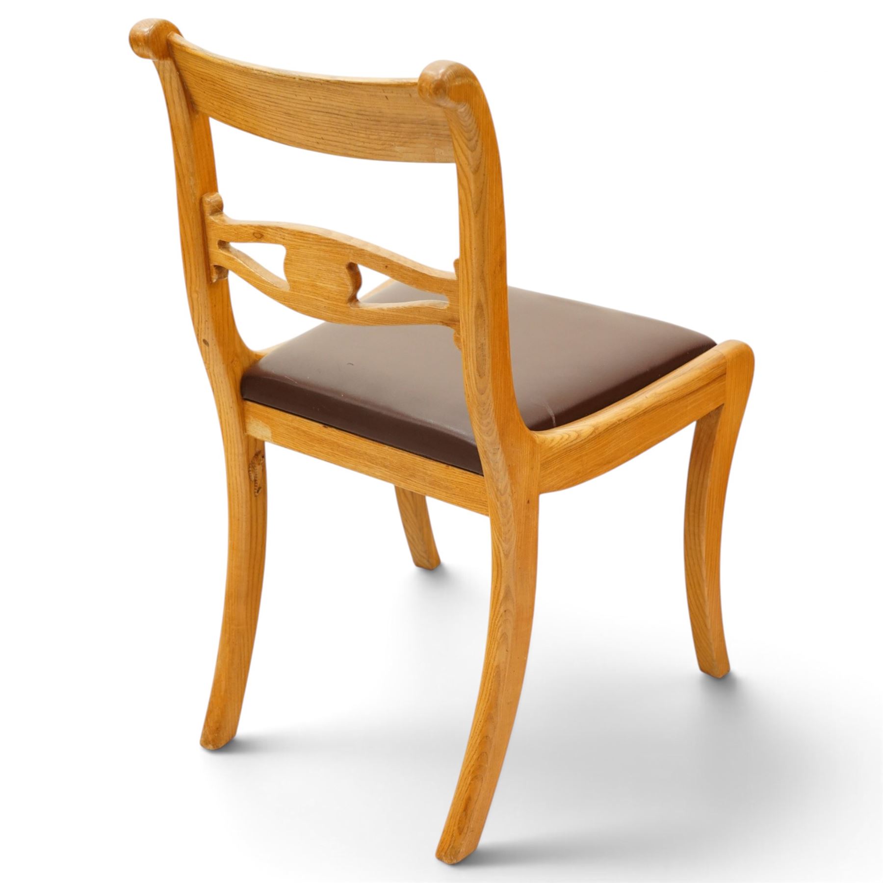 Seahorseman by Shaw & Riley - set of four Yorkshire oak bar-back dining chairs, brown vinyl drop in seat, raised on shaped supports with signature Seahorse carving from the workshop of A. Shaw & Riley Ltd, Hessay
