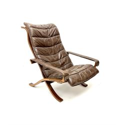 Siesta lounge chair upholstered in dark tan leather 