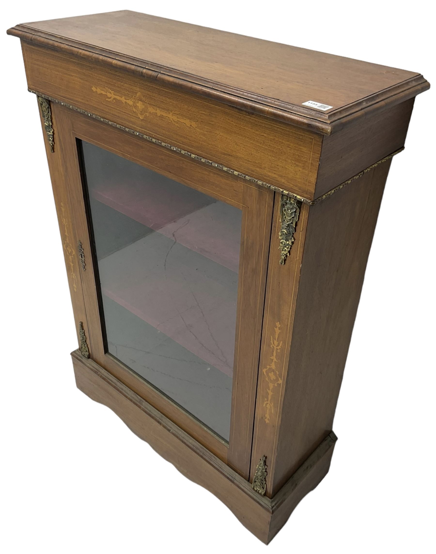 Victorian walnut pier cabinet, moulded rectangular top over inlaid frieze, decorated with gilt metal mounts and beading, the glazed single door flanked by inlaid uprights, on moulded plinth base
