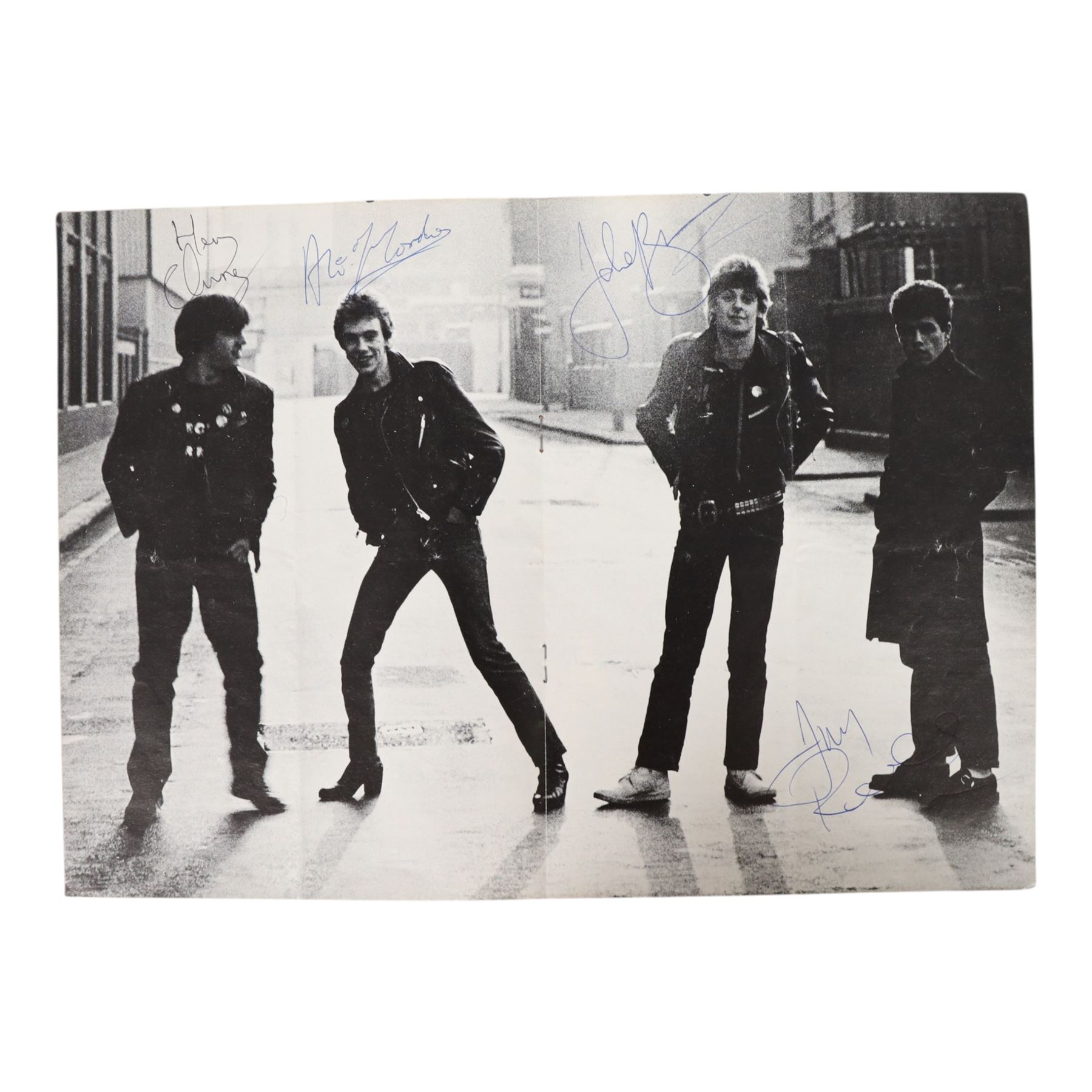 Signed Stiff Little Fingers promotional card, signed by four members of the band Jake Burns, Henry Cluney, Ali McMordie and Jim Reilly, two unsigned promotional cards,  'Go For It' 1981 tour programme and a collection of photographs from the gig