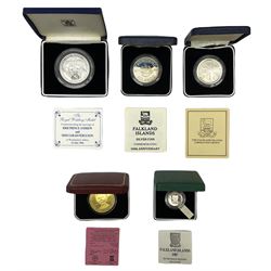 Silver coins and medallions comprising Falkland Islands 1982 proof fifty pence, 1983 proof fifty pence and 1987 silver proof piedfort one pound, Isle of Man 1980 proof one crown and The Royal Mint commemorative medallion for the marriage of 'HRH Prince Andrew and Miss Sarah Ferguson', all sterling silver and cased with certificates