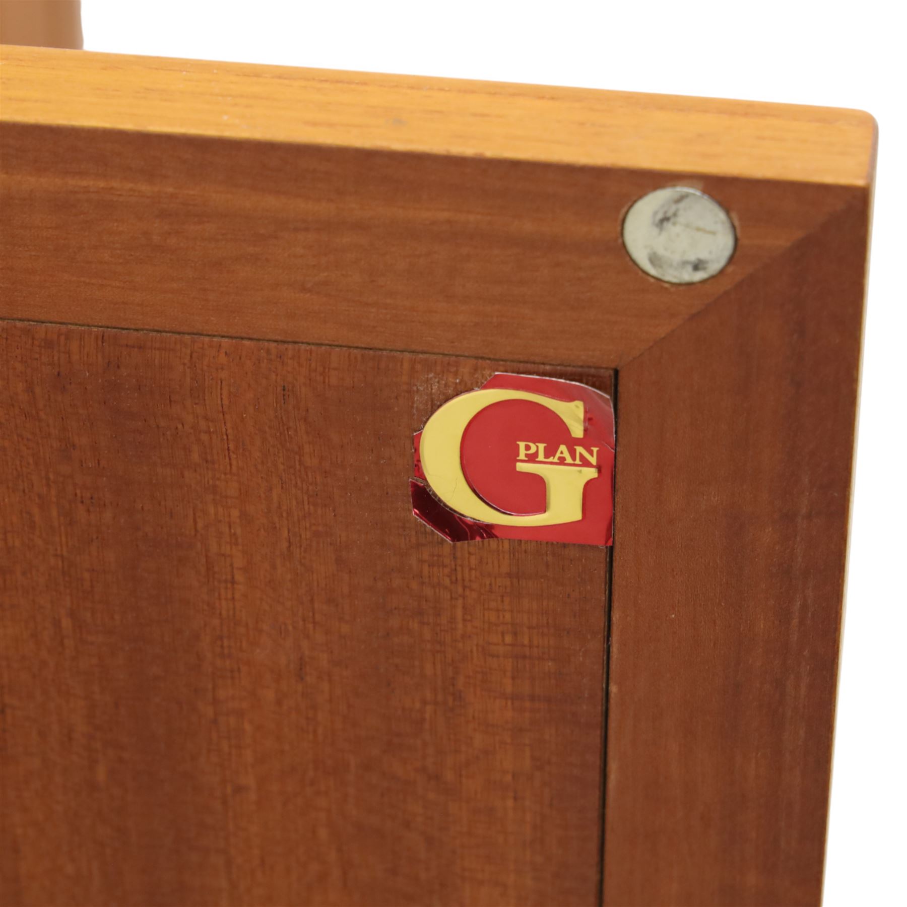 G Plan - 'Fresco' teak side unit, rectangular top above twin cupboard doors and two drawers, drawers fitted with cassette tape storage and a fall front drawer, raised on a plinth base