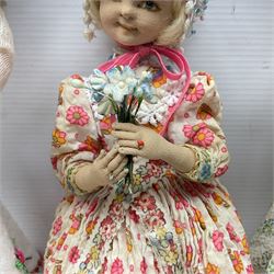 Anna Meszaros Hungary - three hand made needlewrok figurines - each wearing a lon floral dress and bonnet and holding a bouquet of flowers, tallest H32cm (3)  Auctioneer's Note: Anna Meszaros came to England from her native Hungary in 1959 to marry an English businessman she met while demonstrating her art at the 1958 Brussels Exhibition. Shortly before she left for England she was awarded the title of Folk Artist Master by the Hungarian Government. Anna was a gifted painter of mainly portraits and sculptress before starting to make her figurines which are completely hand made and unique, each with a character and expression of its own. The hands, feet and face are sculptured by layering the material and pulling the features into place with needle and thread. She died in Hull in 1998.