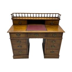 20th century oak twin pedestal clerks' desk, fitted with eleven drawers, raised gallery, tilting leather inset