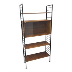 Staples Ladderax - mid-20th century teak and metal framed modular wall unit, fitted with central cupboard, the sliding glazed doors enclosing single shelf, flanked by three adjustable shelves 