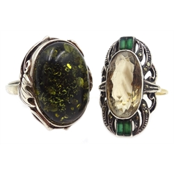  Gold and silver marcasite, smoky quartz ring, stamped 9ct, green amber ring stamped 925 and lion brooch stamped Stirling  