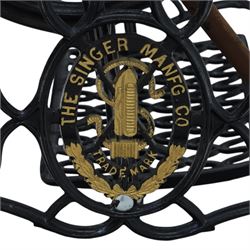 Sewing machine table with glass top, with Singer wrought metal base and foot pedal