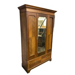 Edwardian mahogany single wardrobe, figured matched veneers to frieze, drawer front and panels, enclosed by bevelled mirror glazed door, base fitted with single drawer, on bracket feet