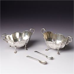 Pair of late Victorian silver salts of oval panel sided design with scroll handles and sha...