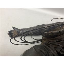 Early 20th century spelter effect figure of a sailor standing in the bow of a boat scanning the horizon, on a simulated rock base with a plaque entitled 'Rescue', base fitted with a timepiece clock movement and two-part dial, with pierced hands, gilt dial centre and ivorene chapter ring written in Arabic numerals, German HAC spring driven going barrel movement wound from the front; with pendulum H65.5cm
