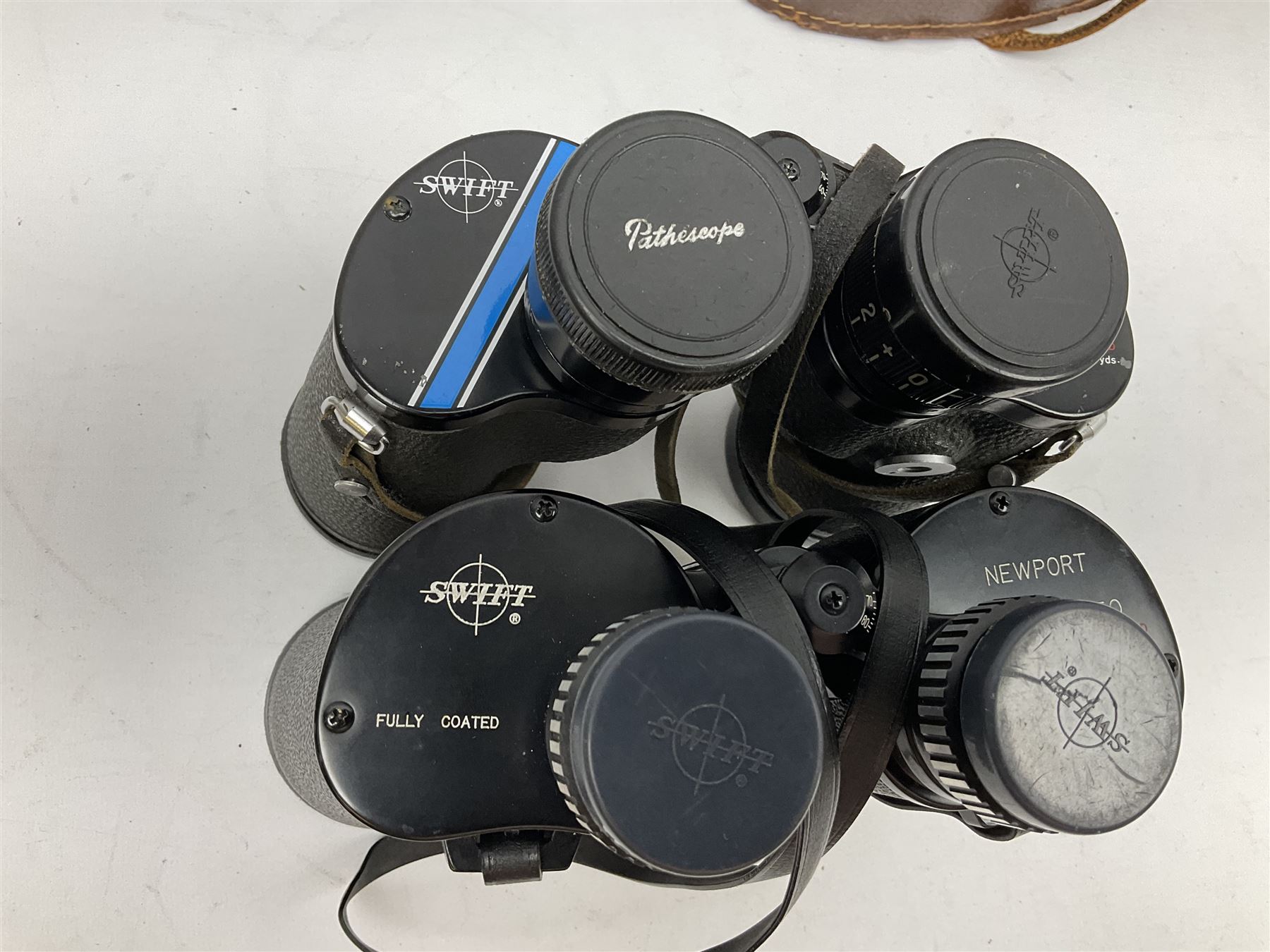 Eleven pairs of Swift binoculars, to include Greens 8x40, Saratoga 8x40, two pairs of Newport Mk II 10x50, Newport 10x50, Saratoga Mk II 8x40, Audubon 8.5x44, etc, 