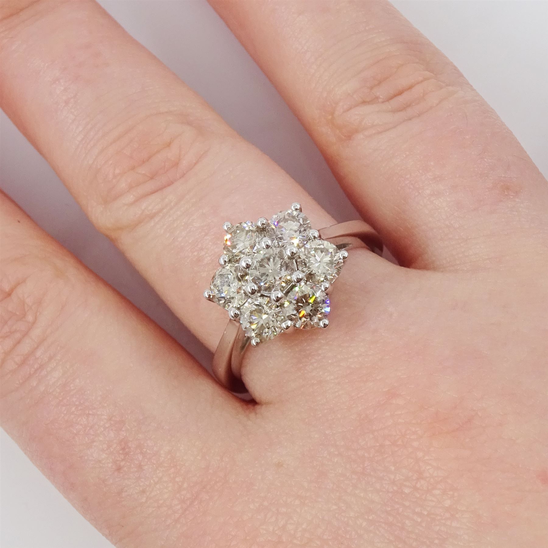 18ct white gold diamond daisy cluster ring, set with seven round brilliant cut diamonds, stamped 750, total diamond weight 2.16 carat, with World Gemological Institute report