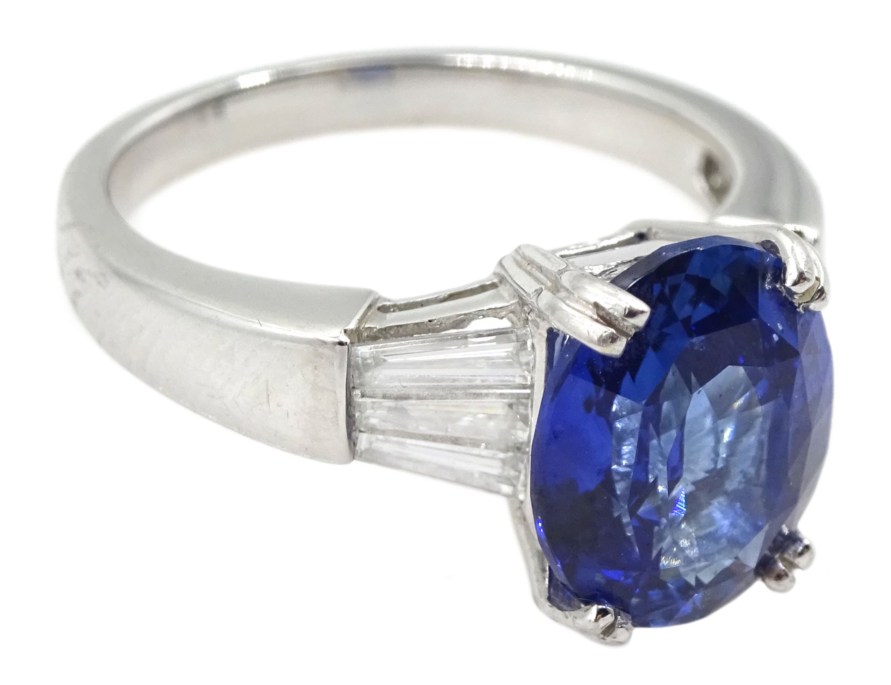 18ct white gold oval sapphire ring, with tapered baguette diamond shoulders, sapphire approx 4.15 carat
