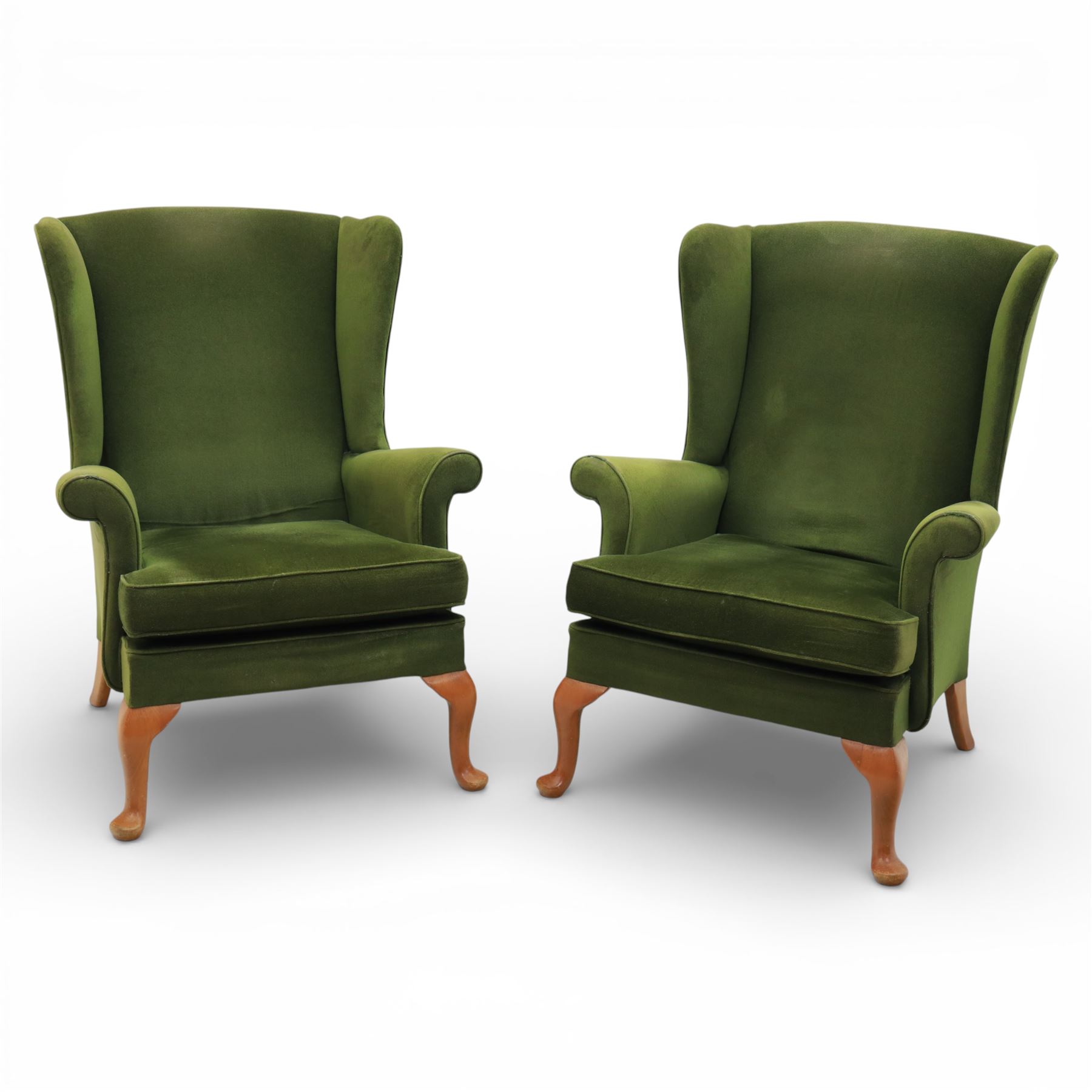 Parker Knoll - pair of 'Penhurst' wingback armchairs upholstered in olive green fabric, on light stained supports 