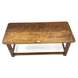 Medium rectangular oak coffee table, outplayed supports joined by perimeter stretcher 