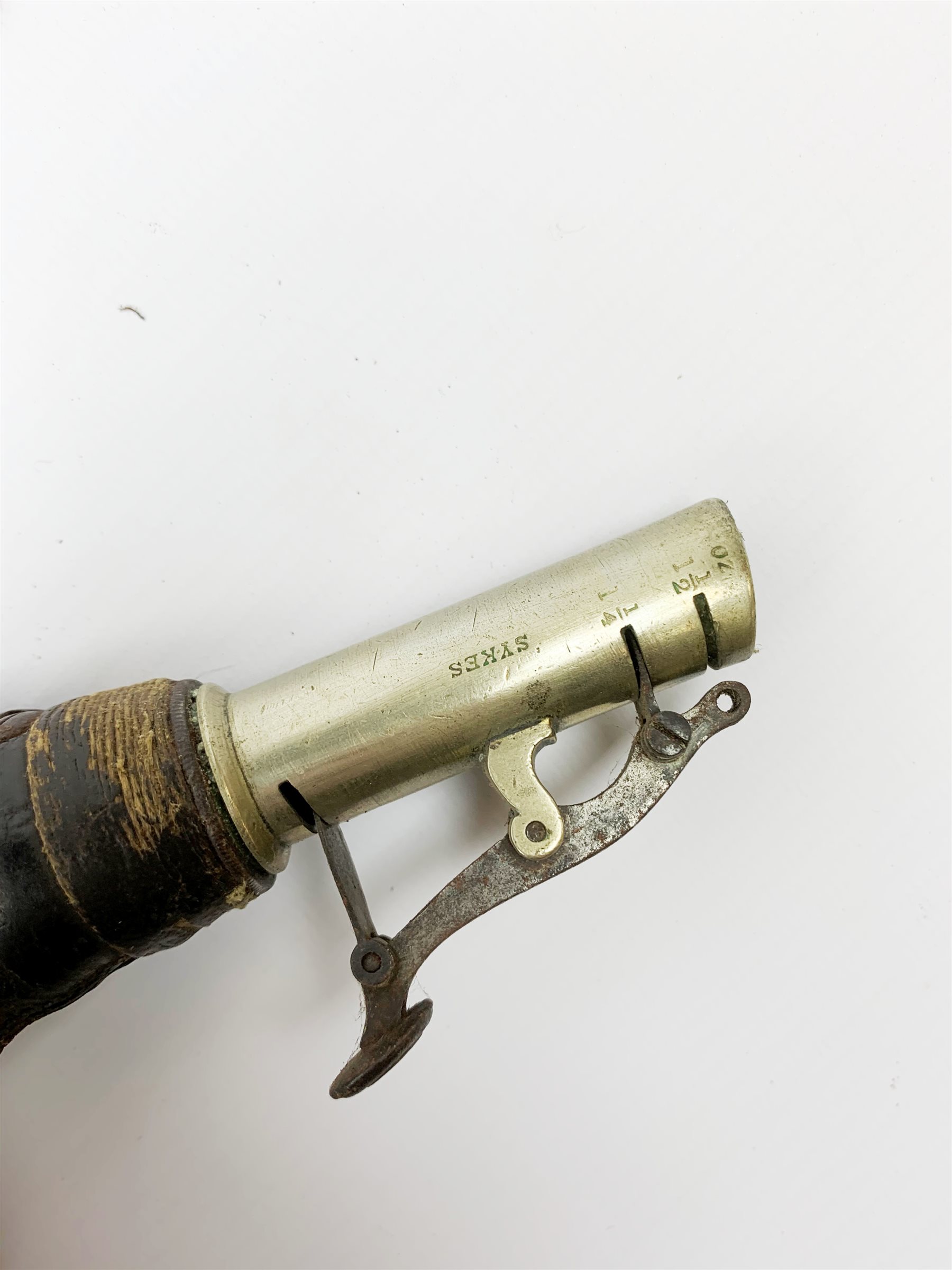 Victorian large copper powder flask embossed with a hunting scene within an oak leaf border with stag and fox heads, the nozzle marked 'Extra Quality Sykes Patent', fitted with four suspension rings H24cm; together with Victorian leather shoulder shot flask with Sykes nozzle L80cm (2)