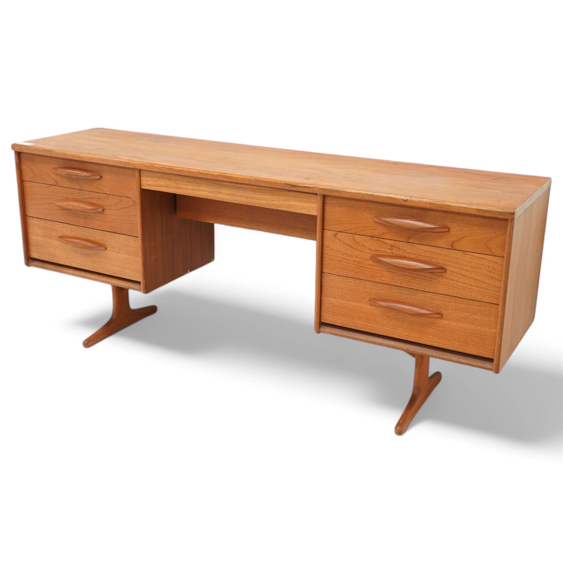 Austinsuite - mid-20th century teak dressing table or desk, fitted with seven drawers