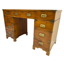 Late 20th century yew wood military design twin pedestal desk, rectangular top with three inset leather panels, fitted with nine drawers, brass brackets and recessed brass handles, on bracket feet
