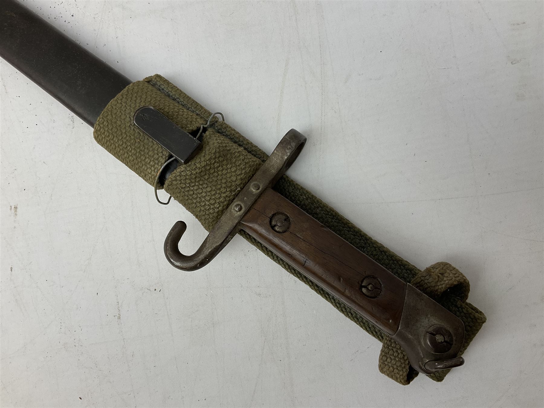Austrian Model 1895 carbine NCO's knife bayonet with 25cm fullered steel blade; in steel scabbard with webbing frog L39cm overall; and Spanish Model 1941 Bolo bayonet with 25cm fullered steel blade No.6412D; in steel scabbard (2)