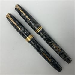 Conway Stewart Executive 60 fountain pen, the barrel and cap with hatched grey and black marble decoration and gold nib stamped Duro 14ct, together with a Conway Stewart 58 fountain pen similarly decorated in pearl blue and black with gold nib stamped 14ct, largest 13cm (2)