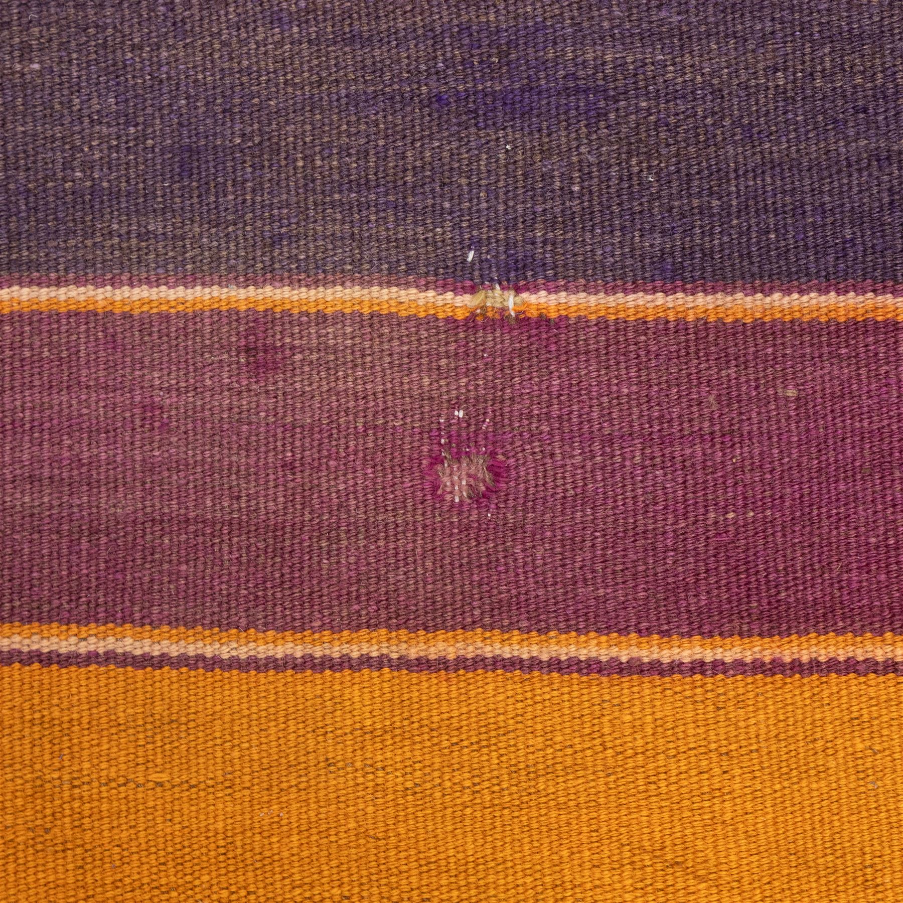 South West Persian Qashqai flatweave kilim, field decorated with bold horizontal bands in shades of aubergine, plum and orange, ochre, olive and lilac, interspersed with narrow registers of diagonal chevron motifs in cream and dark brown, framed by brown end panels, with fringe ends 