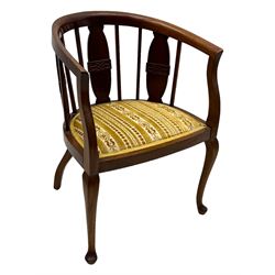 Late Victorian mahogany framed tub chair, rounded backrest with vertical splats and three carved oval medallions, upholstered seat in yellow patterned fabric, on cabriole supports