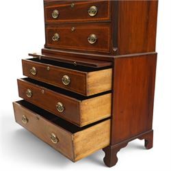  Late 18th century mahogany and inlaid chest on chest, projecting cornice above blind fretwork in laid drawers, the upper chest with two short over three graduating drawers, the lower section with brushing slide over three long graduated drawers, raised on bracket feet