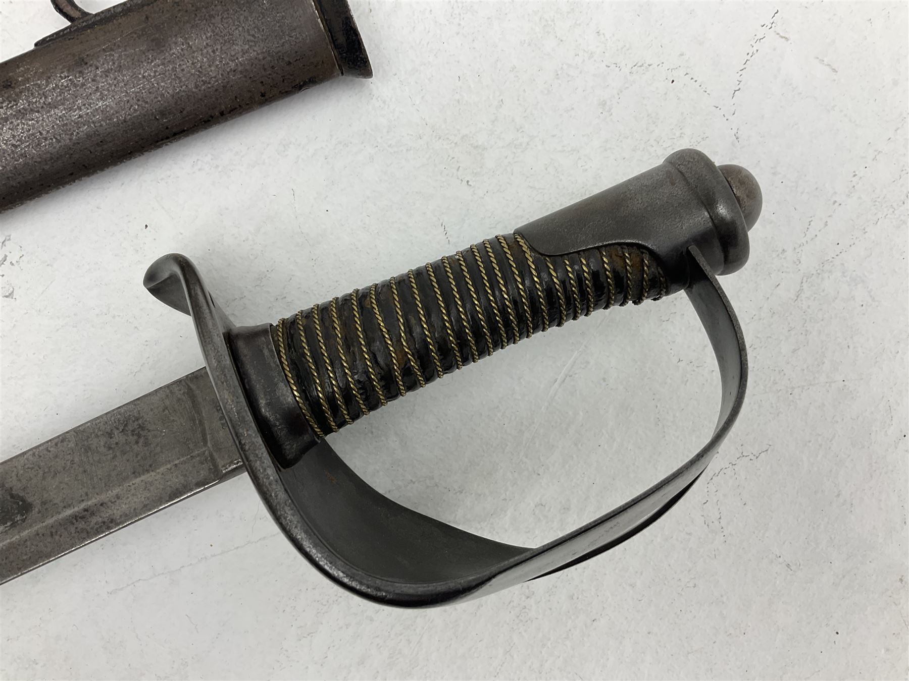 19th century Imperial German army heavy cavalry officers sword by Schnitzler and Kirschbaum, with 89cm single fullered steel blade and sheet steel basket hilt with teardrop cut-out and wire-bound leather grip L107.5cm overall; in steel scabbard with two suspension rings; and British Army 1822 Pattern Infantry Officer's sword in associated scabbard (2)