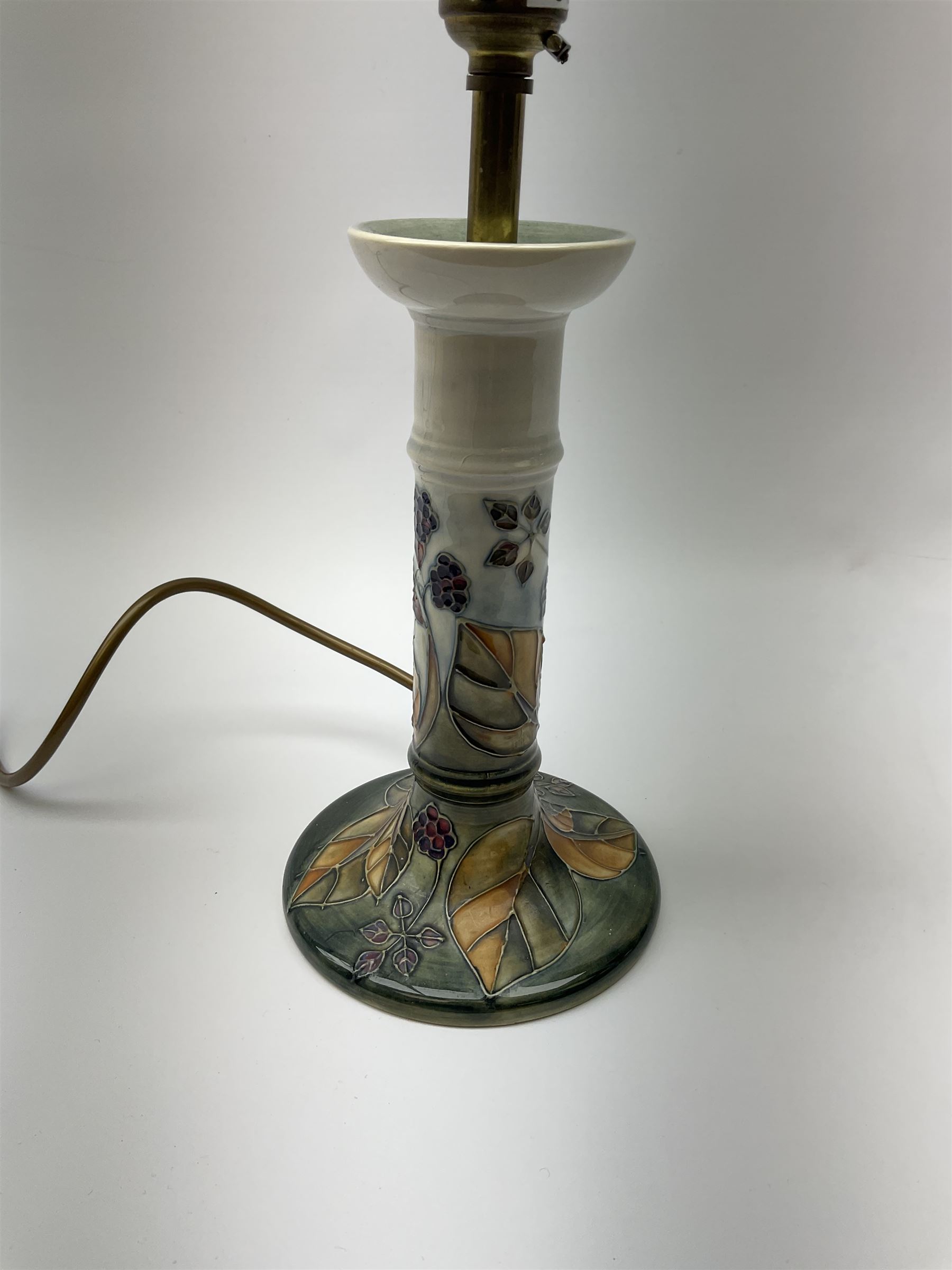 A Moorcroft table lamp, of candle stick form, decorated in the Blackberry and Leaves pattern