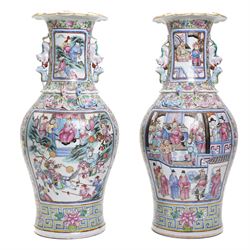 Large pair of 19th century Cantonese famille rose vases, each painted with various courtly...