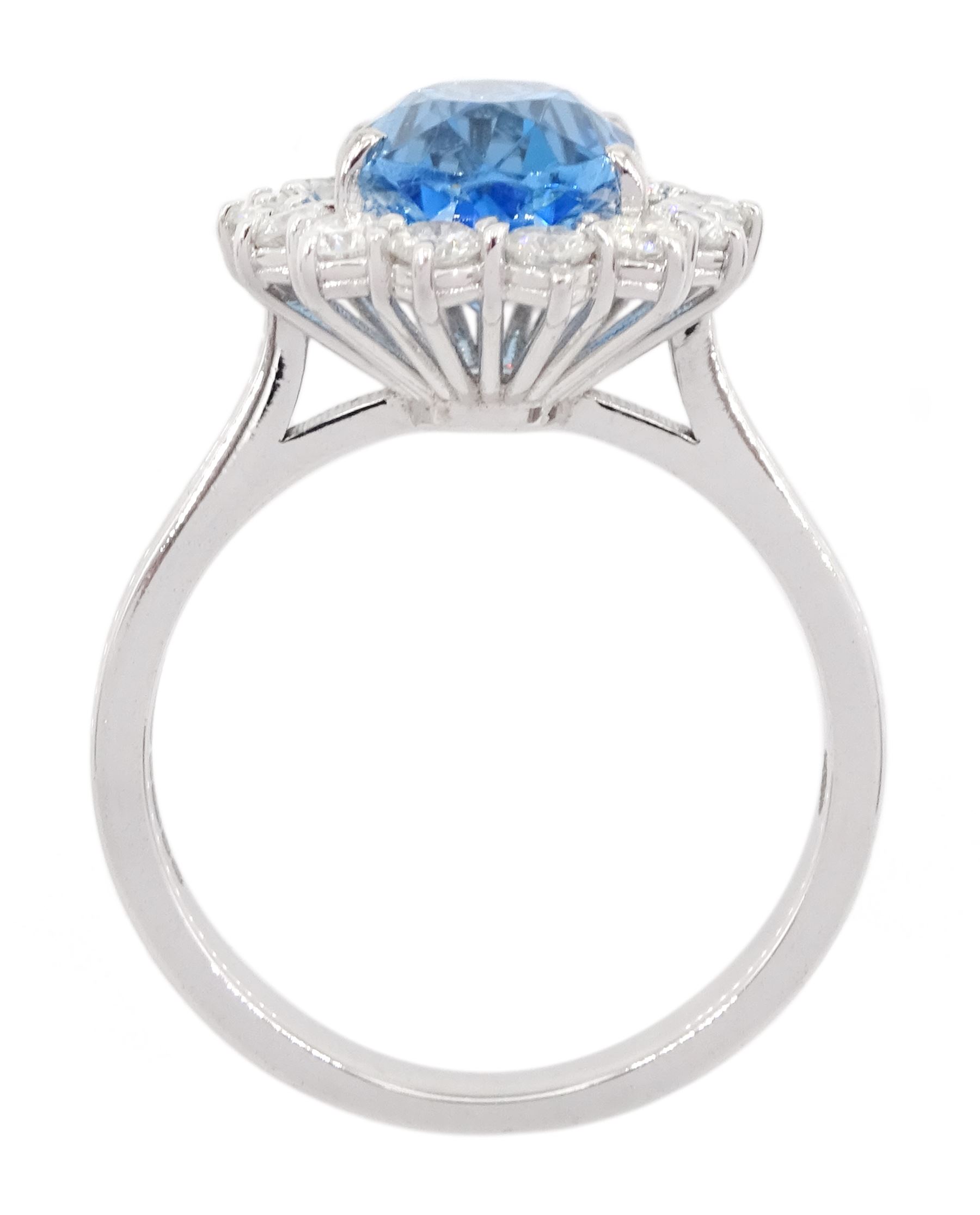 18ct white gold oval cut Swiss blue topaz and round brilliant cut diamond cluster ring, hallmarked