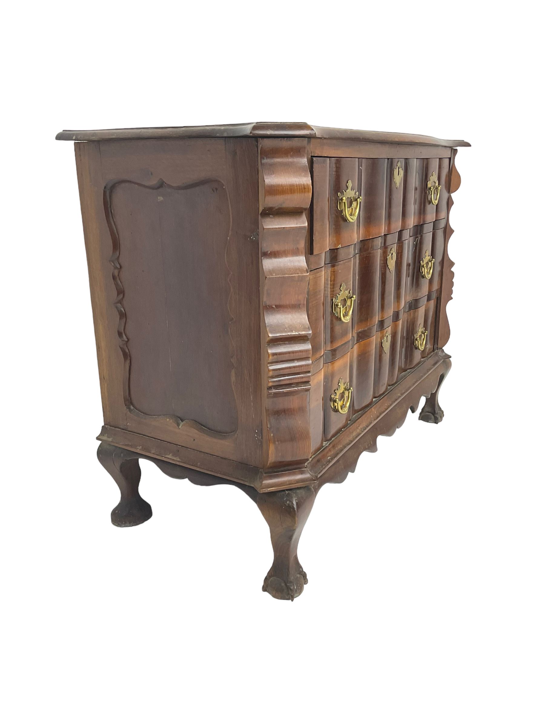 19th century Dutch serpentine chest, moulded edge, fitted with three drawers with shaped fronts and brass handle pulls, flanked by shaped uprights and panelled sides, raised on cabriole supports terminating in ball and claw feet