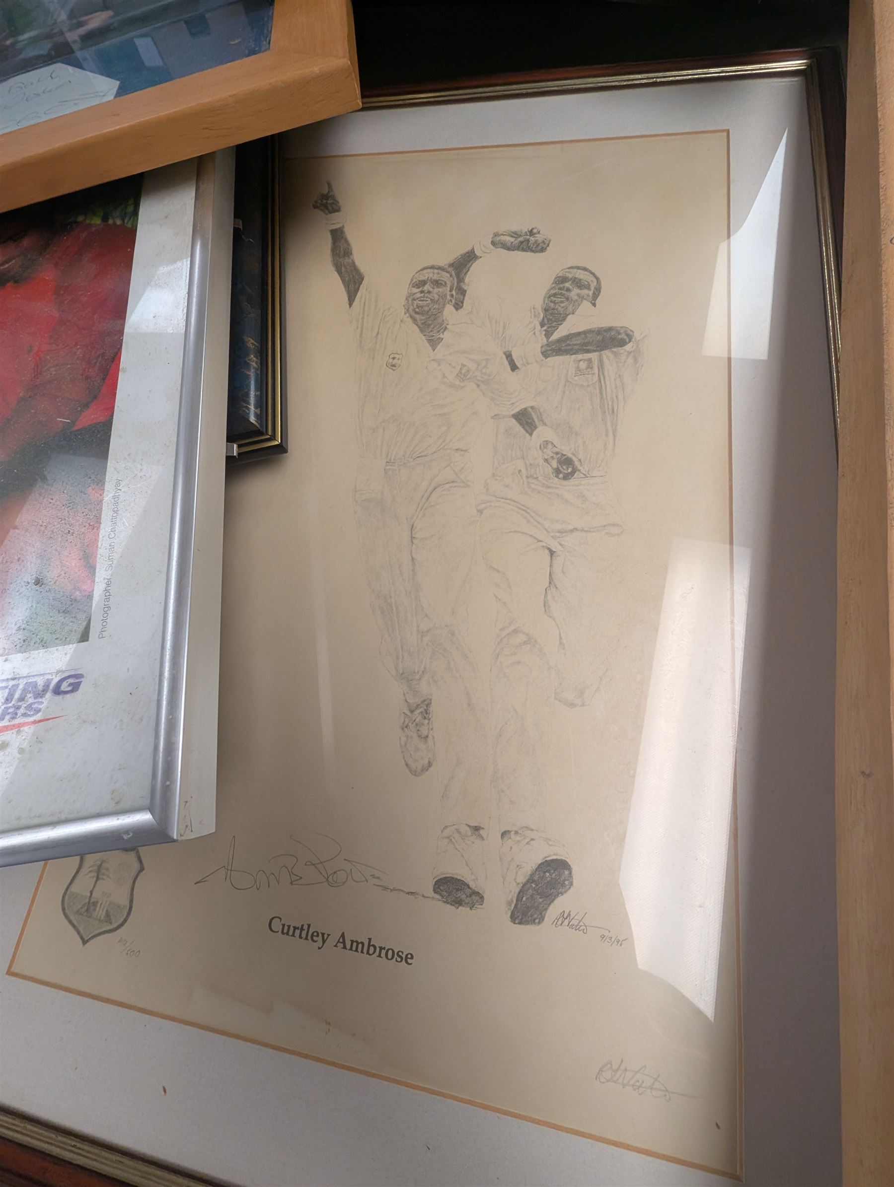 Collection of signed International cricket memorabilia, mostly relating to West Indies, including Curtly Ambrose and Brian Lara prints, Shane Warne and Glen McGrath last test souvenirs, signed Zimbabwe 2003 tour cricket bat, etc