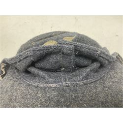 WW2 German Luftwaffe M43 field cap with triangular cloth eagle and roundel badge; marked '1944 ?/0501/0015 57'