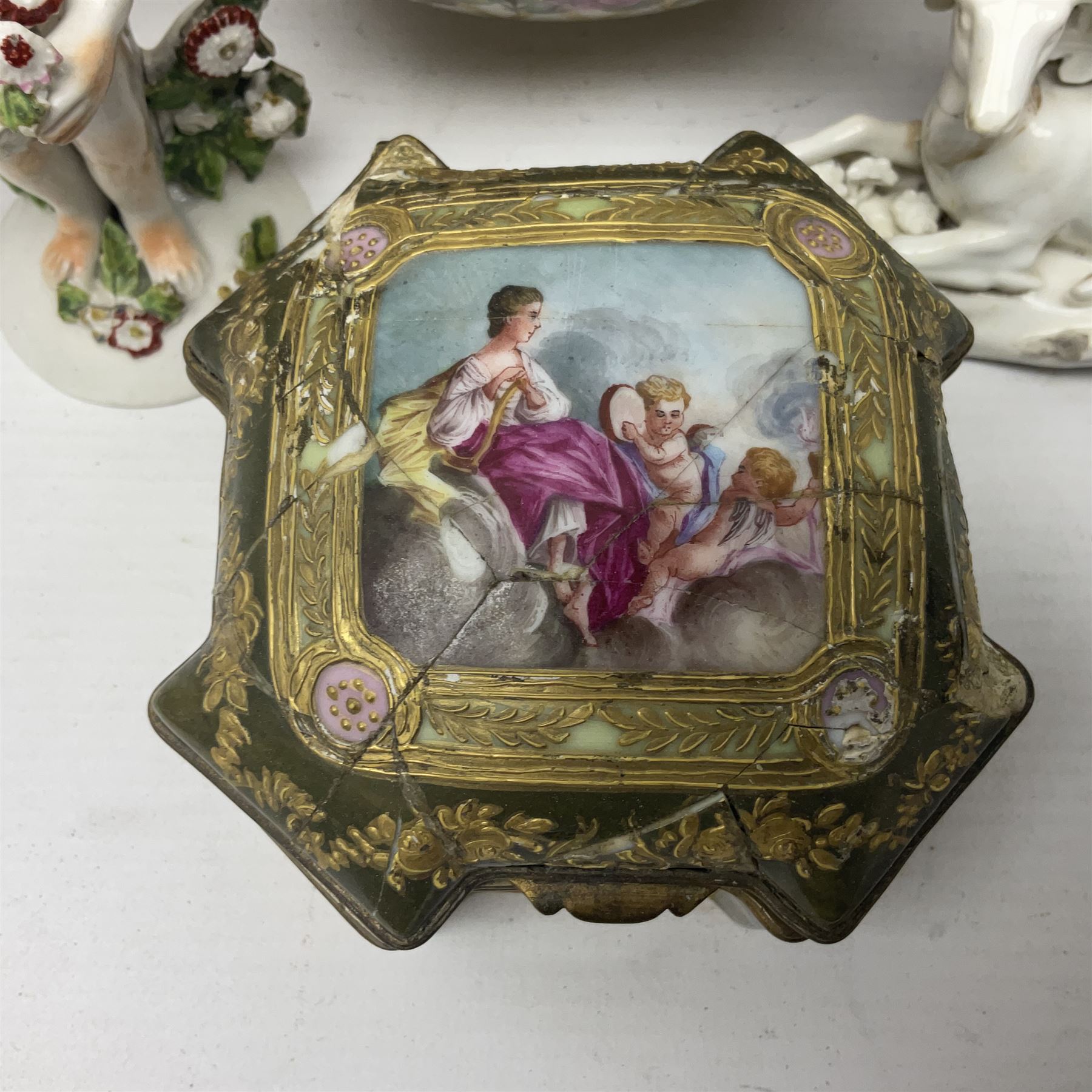 Group of 18th and 19th century ceramics for repair and restoration, to include an 18th century Derby figure emblematic of the Continent of Africa, pair of small 19th century Derby vases, painted with birds and floral spray, 19th century Derby slop bowl decorated in the 594 pattern with pink roses against gilt trellis, 19th century Derby figure of a recumbent deer, Serves style box, and two further figures
