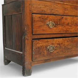 Georgian rustic oak housekeeper’s cupboard, moulded cornice above a pair of fielded panel cupboard doors enclosing a boarded interior with central divider and hanging hooks, the base fitted with two long drawers with brass swan neck handles, raised on stile supports